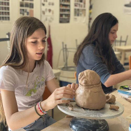 a young student takes an art class for kids at kimball art center in park city